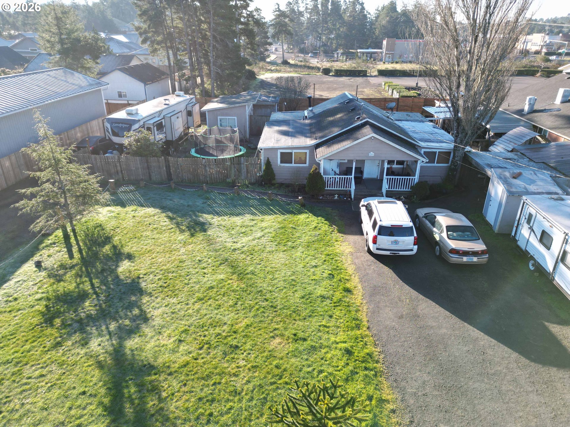 1890 37th Street Florence, OR 97439 - Photo 2 of 41 a aerial view of a house with table and chairs