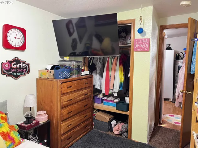 a view of a closet with storage