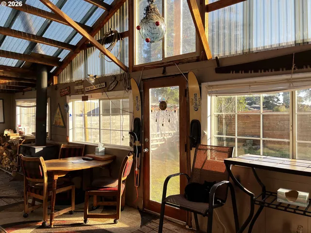 a view of a dining room with furniture and window