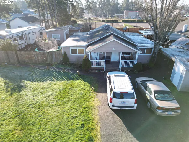 a aerial view of a house with a yard