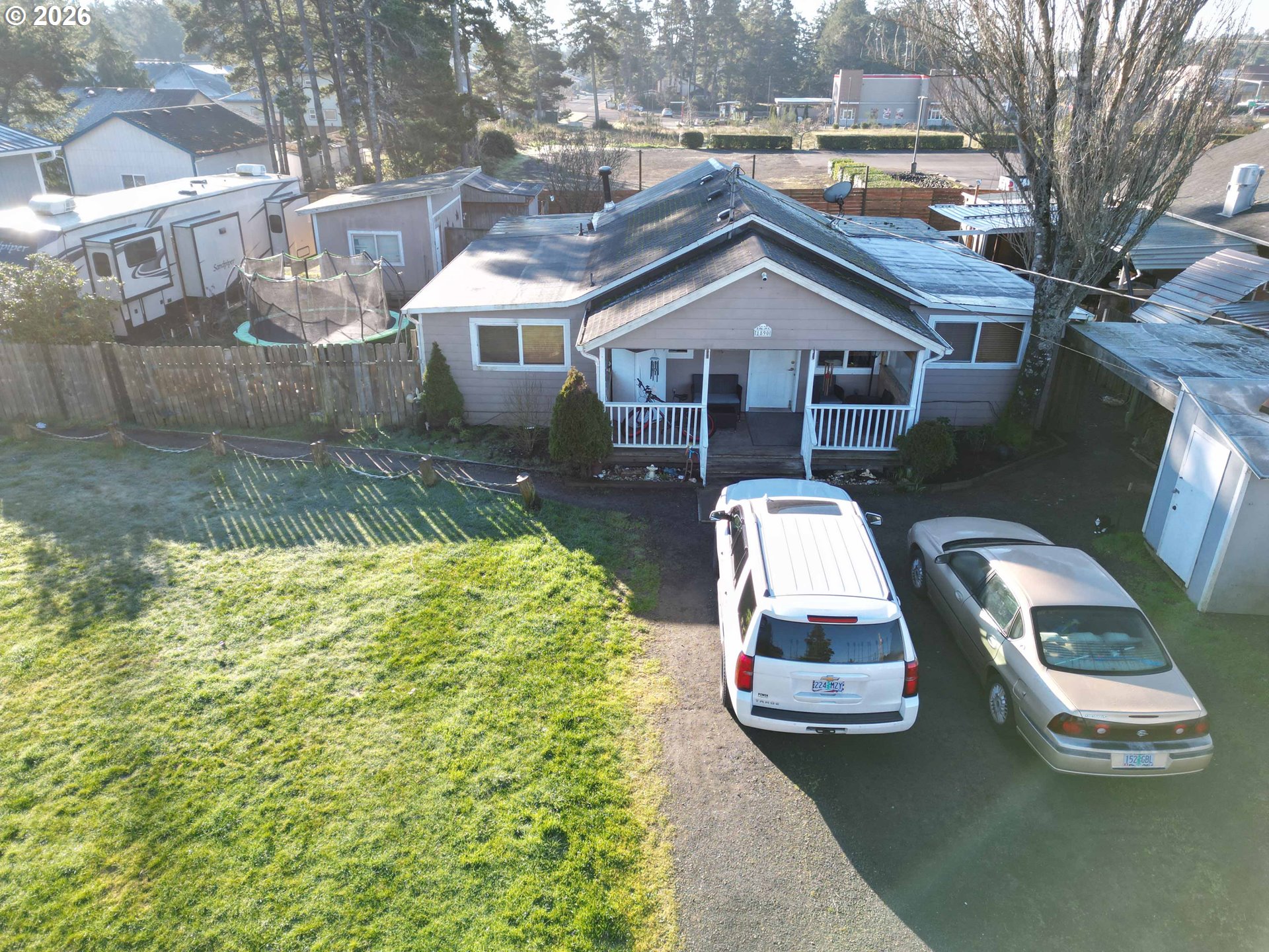 1890 37th Street Florence, OR 97439 - Photo 3 of 41 a aerial view of a house with a yard
