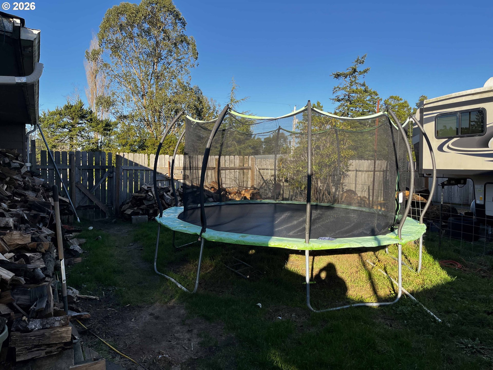 1890 37th Street Florence, OR 97439 - Photo 32 of 41 a view of a chairs and table in backyard