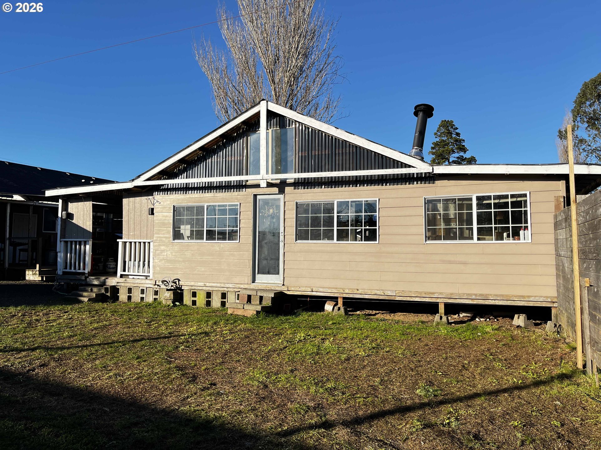1890 37th Street Florence, OR 97439 - Photo 36 of 41 a front view of a house with a yard