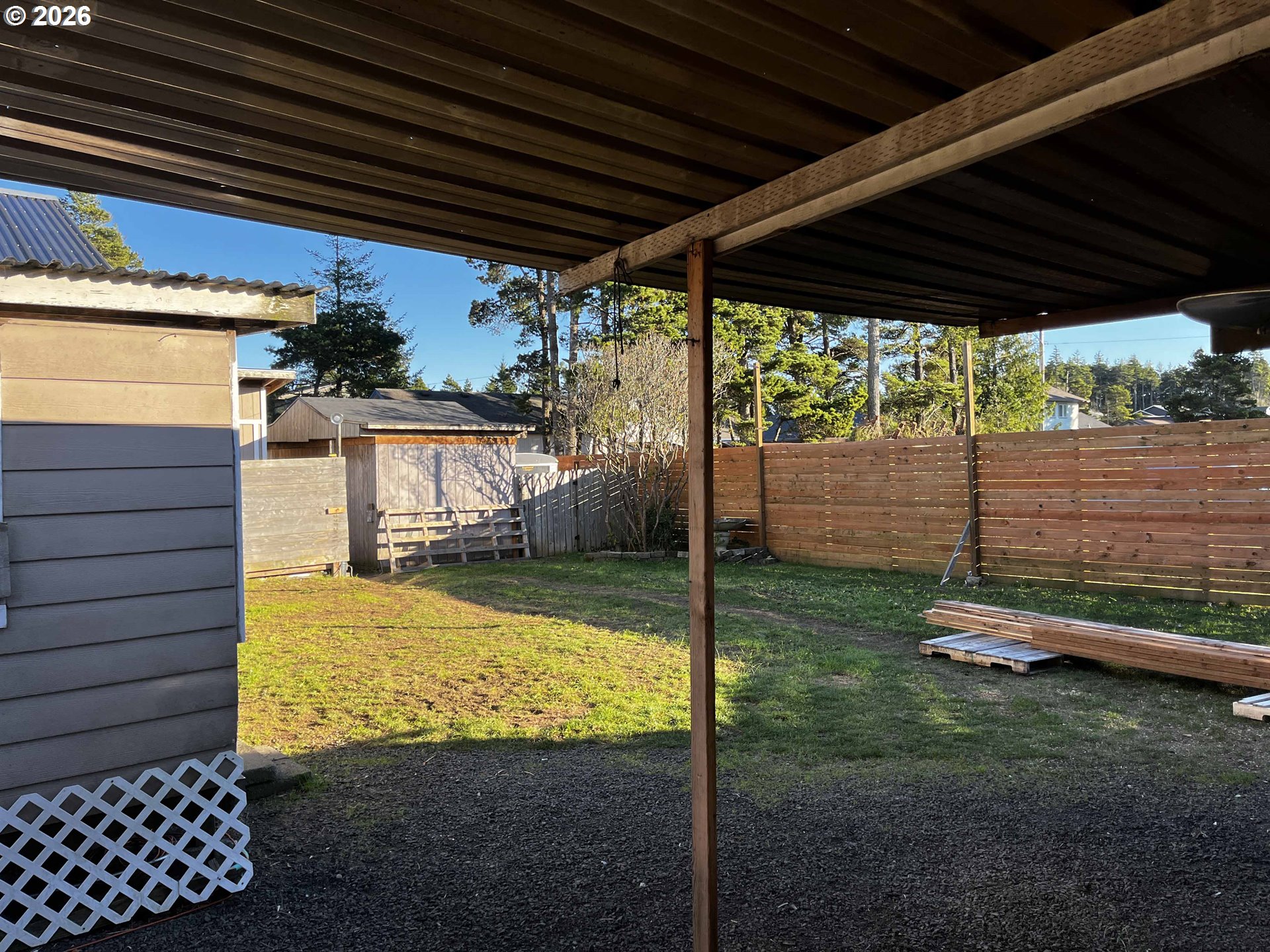 1890 37th Street Florence, OR 97439 - Photo 39 of 41 a view of a backyard with wooden floor