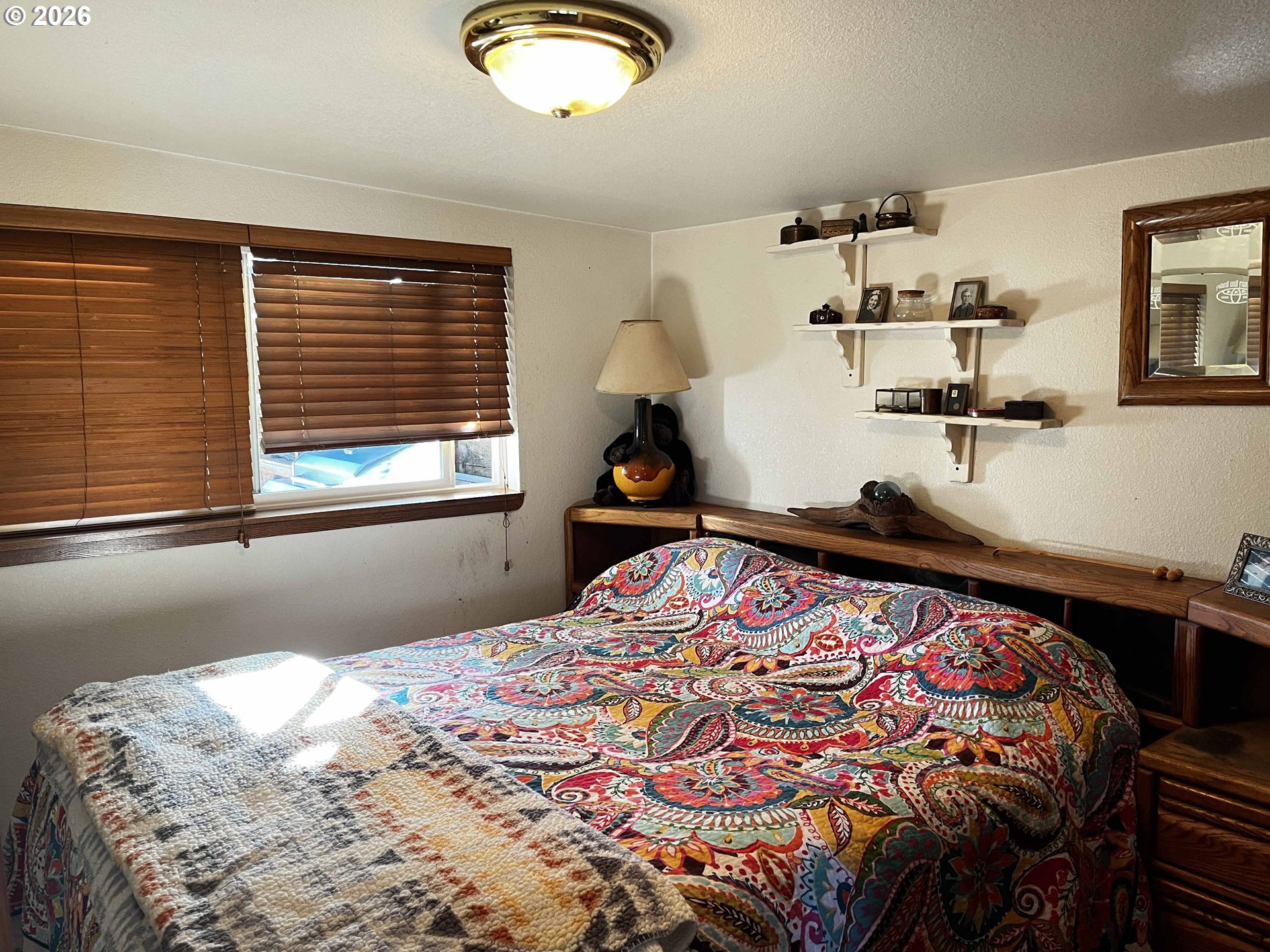 1890 37th Street Florence, OR 97439 - Photo 6 of 41 a bedroom with a bed and window