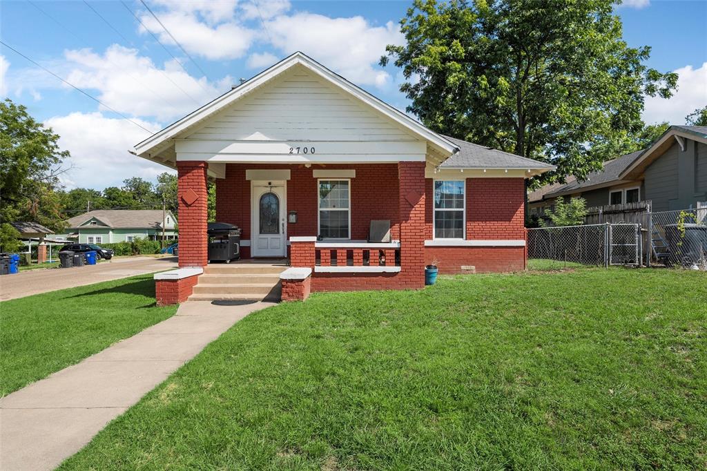 Bungalow-style house with brick siding, covered porch, and crawl space