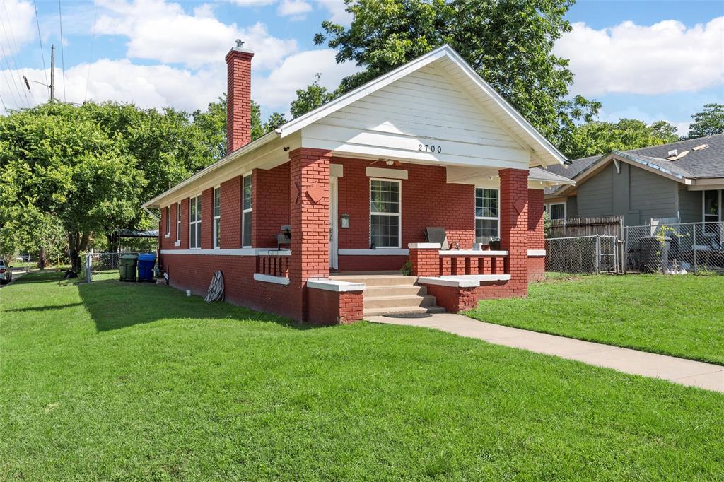 2700 Cole Avenue Waco, TX 76707 - Photo 2 of 14 Bungalow-style home with brick siding, a porch, and a chimney