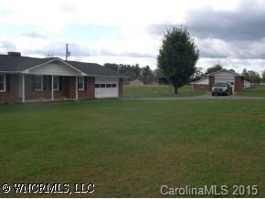 4006 Chimney Rock Road Hendersonville, NC 28792 - Photo 2 of 6 a front view of a house with a garden