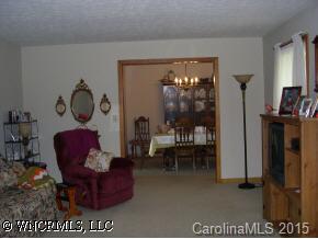 4006 Chimney Rock Road Hendersonville, NC 28792 - Photo 4 of 6 a living room with furniture rug and window