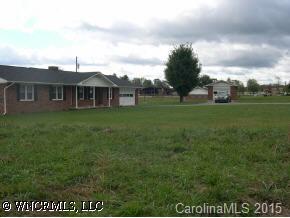 4006 Chimney Rock Road Hendersonville, NC 28792 - Photo 6 of 6 a view of a big yard with large trees and a big yard