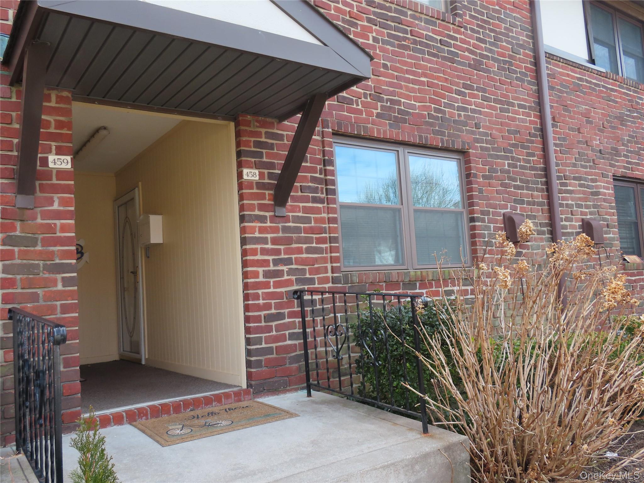 a brick house with a large windows