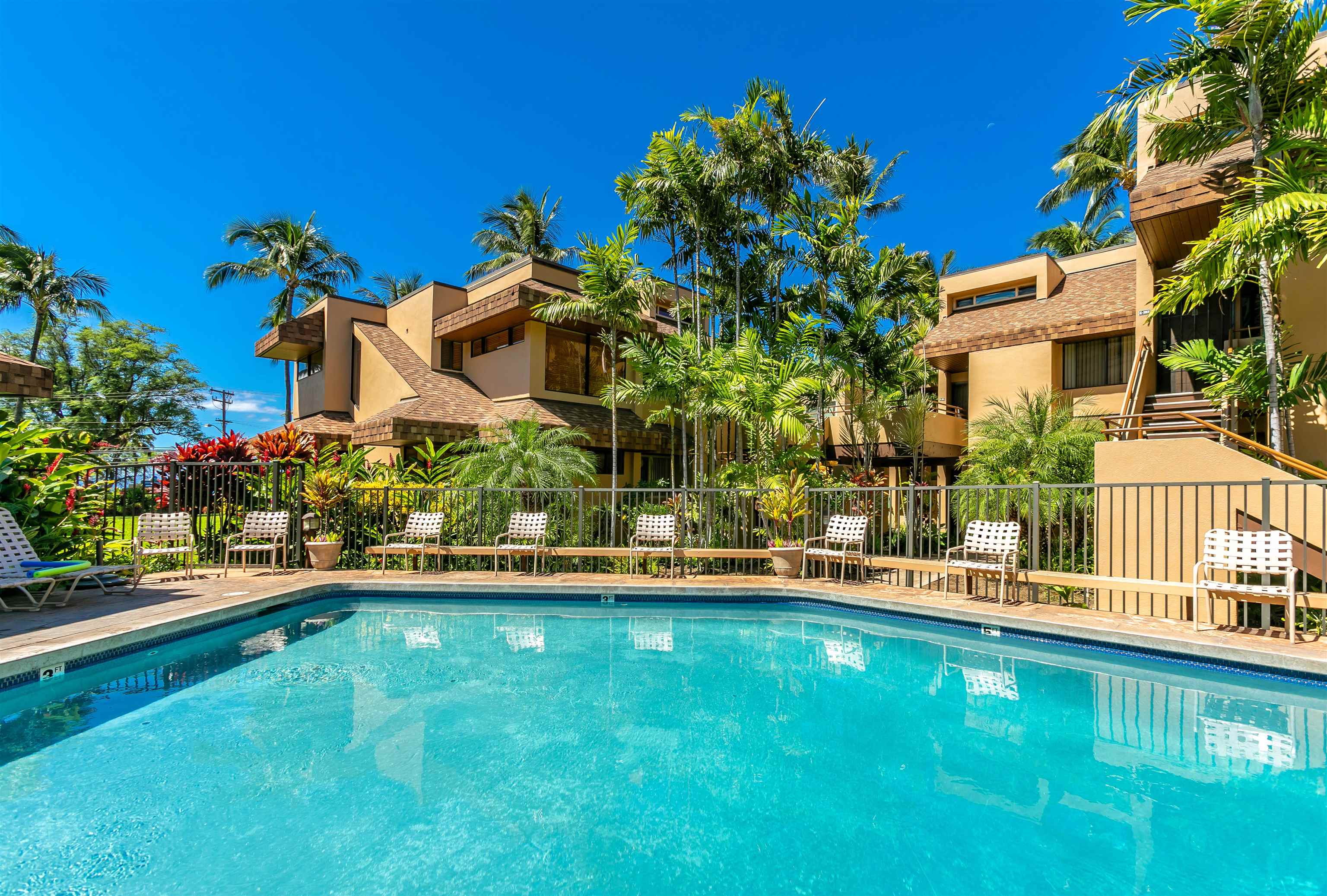 2381 South Kihei Road, Unit C109 Kihei, HI 96753 - Photo 20 of 25 a view of a house with a yard and sitting area
