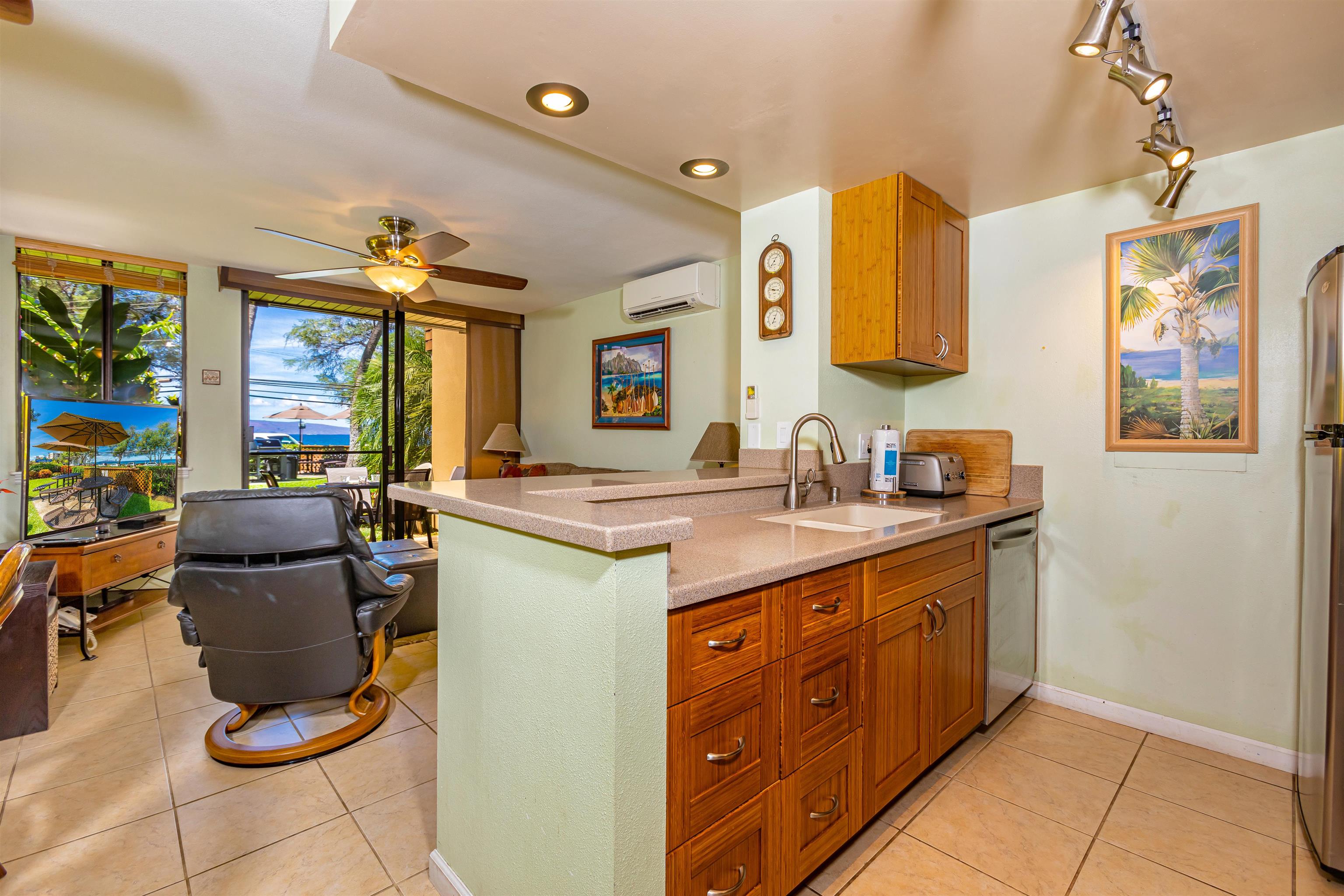 2381 South Kihei Road, Unit C109 Kihei, HI 96753 - Photo 4 of 25 a spacious bathroom with a granite countertop sink and a mirror
