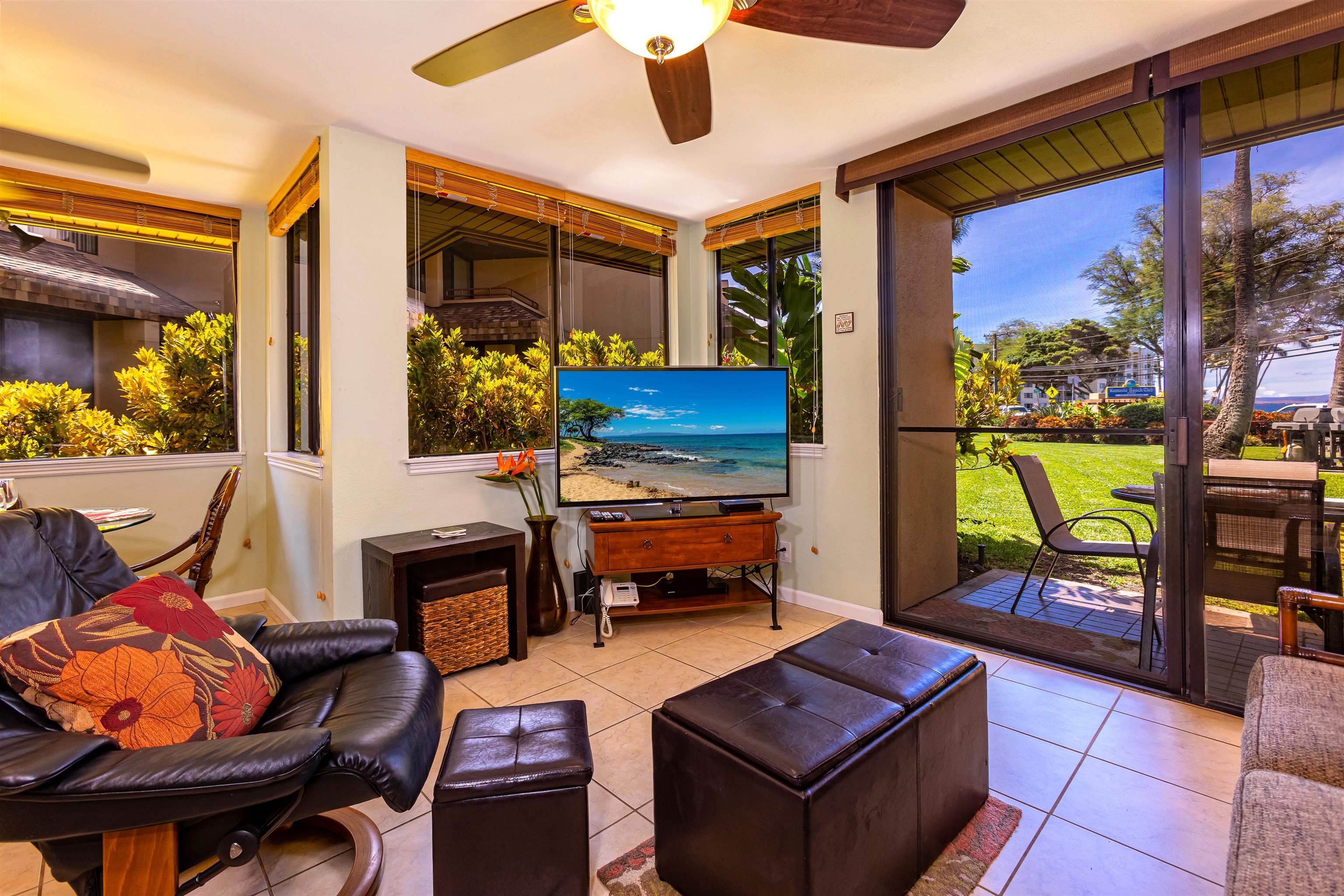 2381 South Kihei Road, Unit C109 Kihei, HI 96753 - Photo 8 of 25 a living room with furniture and a floor to ceiling window