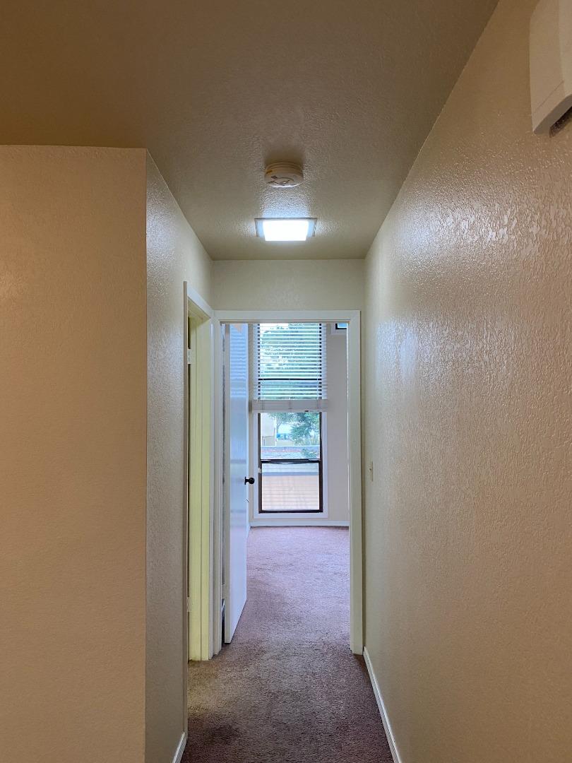 1051 Padre Drive, Unit 7 Salinas, CA 93901 - Photo 11 of 22 an empty room with windows and closet