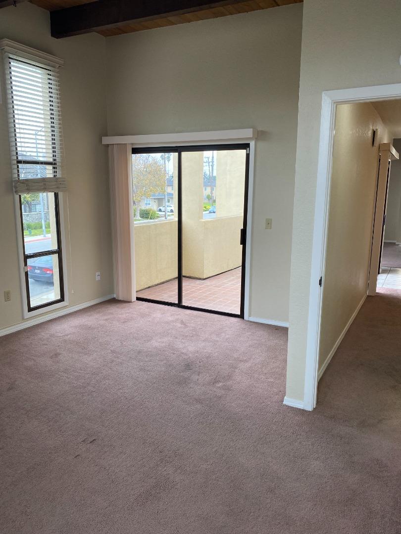 1051 Padre Drive, Unit 7 Salinas, CA 93901 - Photo 19 of 22 an empty room with windows lake and mountain view