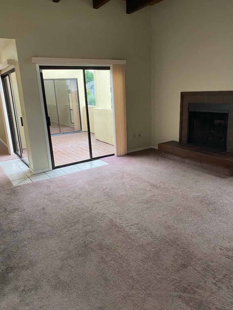 1051 Padre Drive, Unit 7 Salinas, CA 93901 - Photo 3 of 22 a view of an empty room with a fireplace