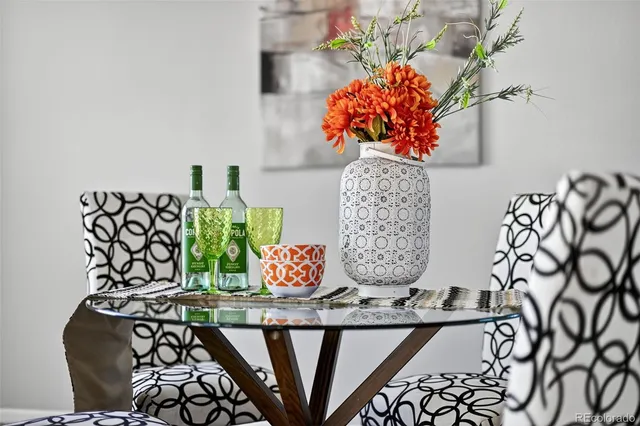 a kitchen with a sink cabinets a wooden floor and a window