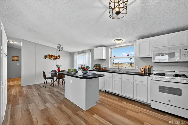 a kitchen with a table and chairs in it