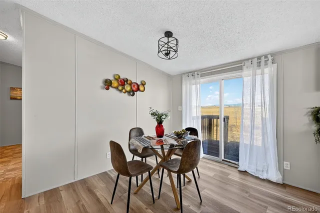 a spacious bedroom with a bed closet and window