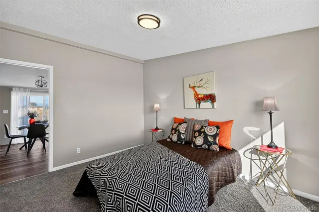 a bed room with a bed and a window