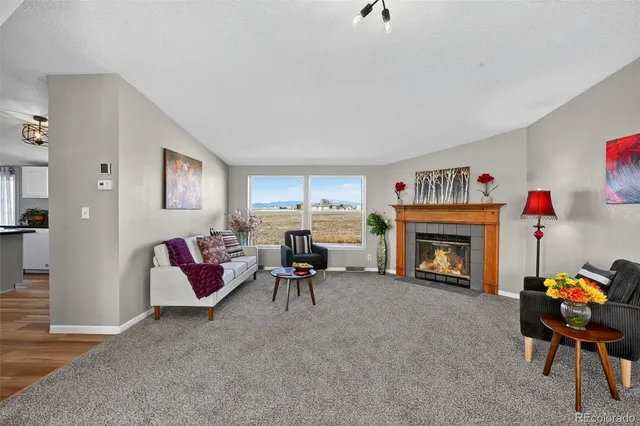 a living room with furniture and a table