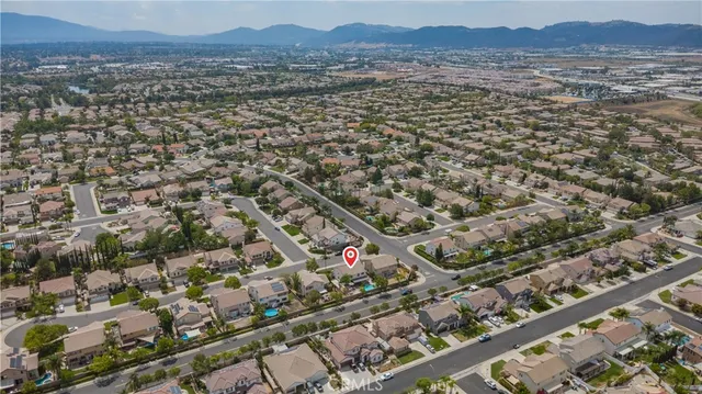 a view of backyard with a tub and wooden fence