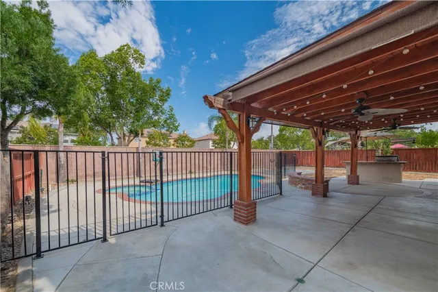 a view of a swimming pool with a patio