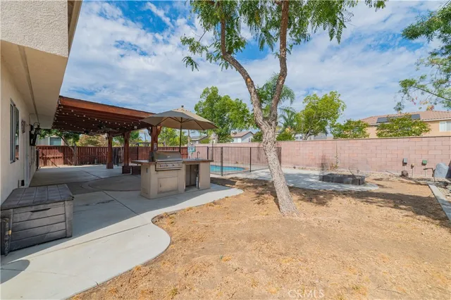 a bedroom with a bed and a ceiling fan