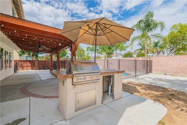 a view of a dining room with furniture and a chandelier