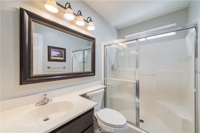 a kitchen with stainless steel appliances a refrigerator and a stove top oven