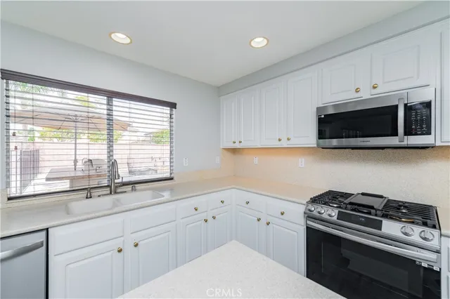 a white bath tub sitting next to a white sink