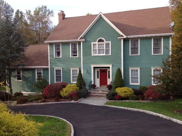 31 Owl Hill Road Monroe, CT 06468 - Photo 1 of 1 a front view of house with yard and trees around
