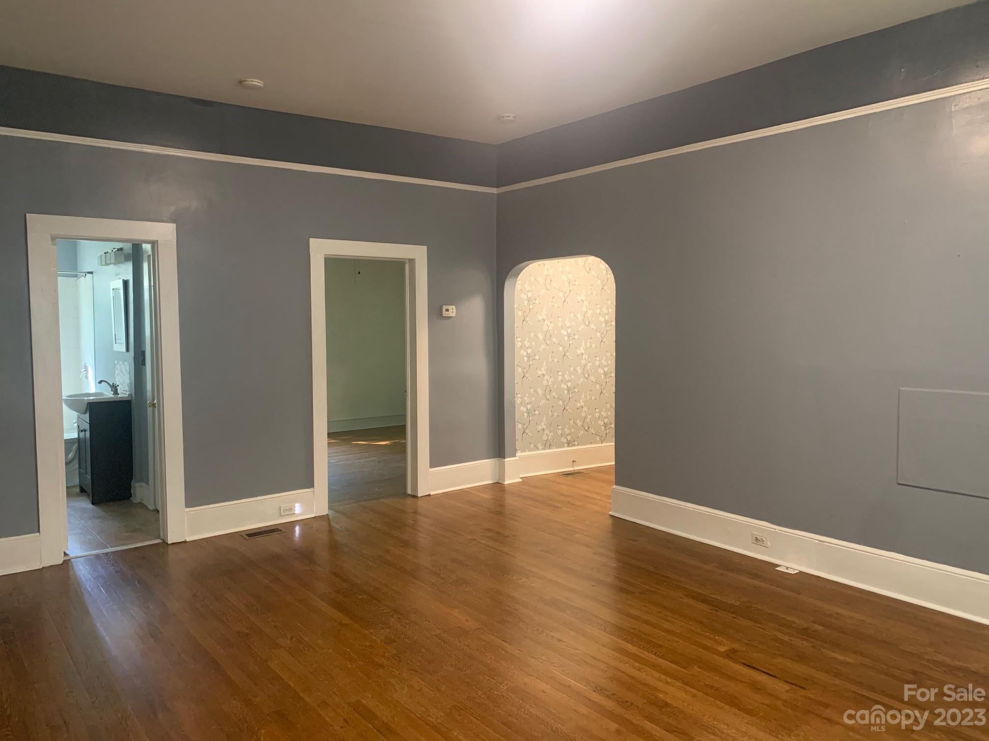 5616 Charlie Walker Road Kannapolis, NC 28081 - Photo 2 of 13 an empty room with wooden floor and closet