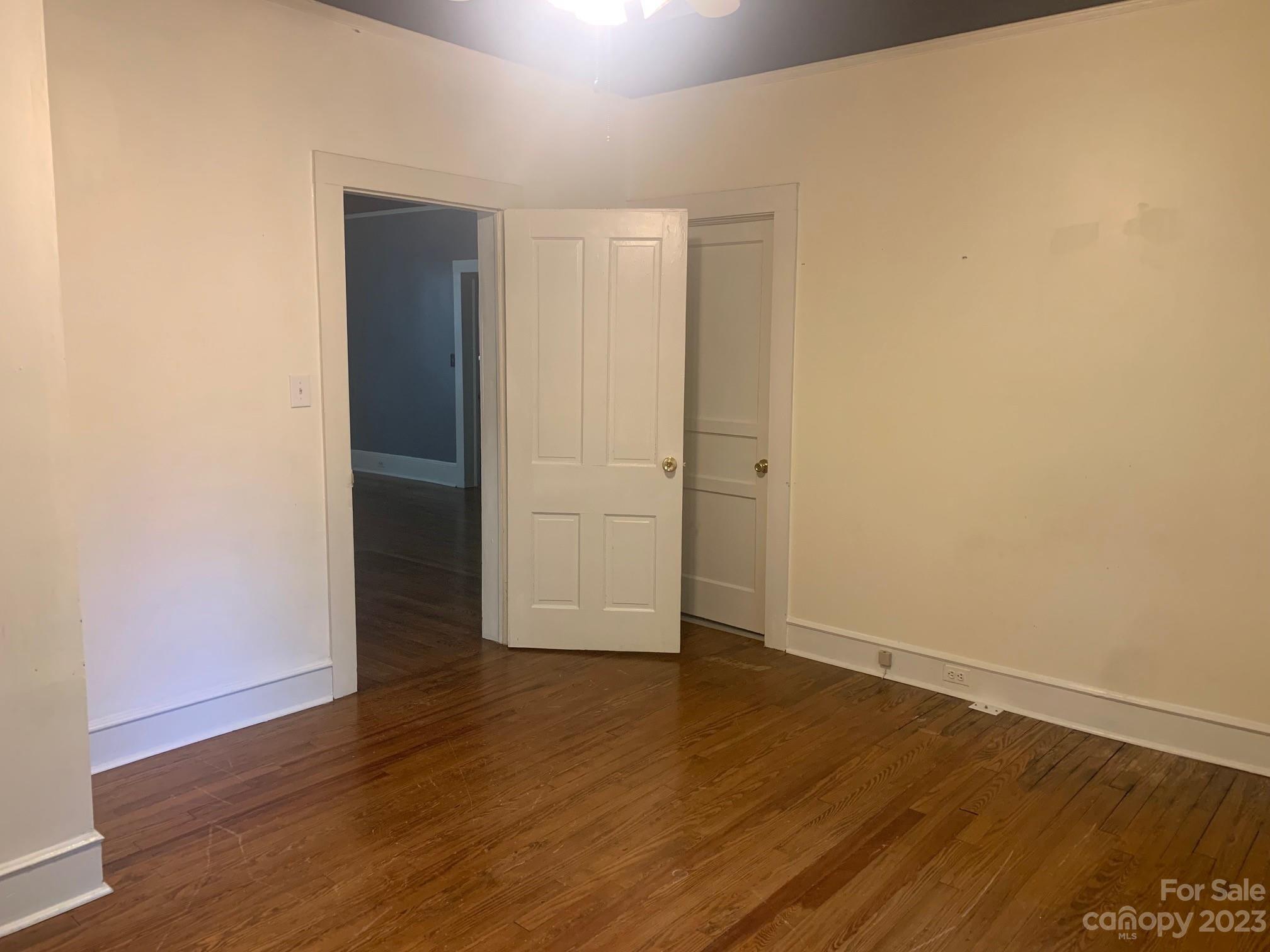 5616 Charlie Walker Road Kannapolis, NC 28081 - Photo 7 of 13 an empty room with wooden floor