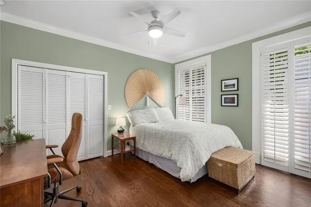 a bed room with a bed and a chair