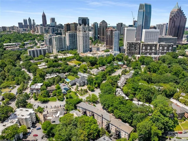 a view of a brick house with a yard