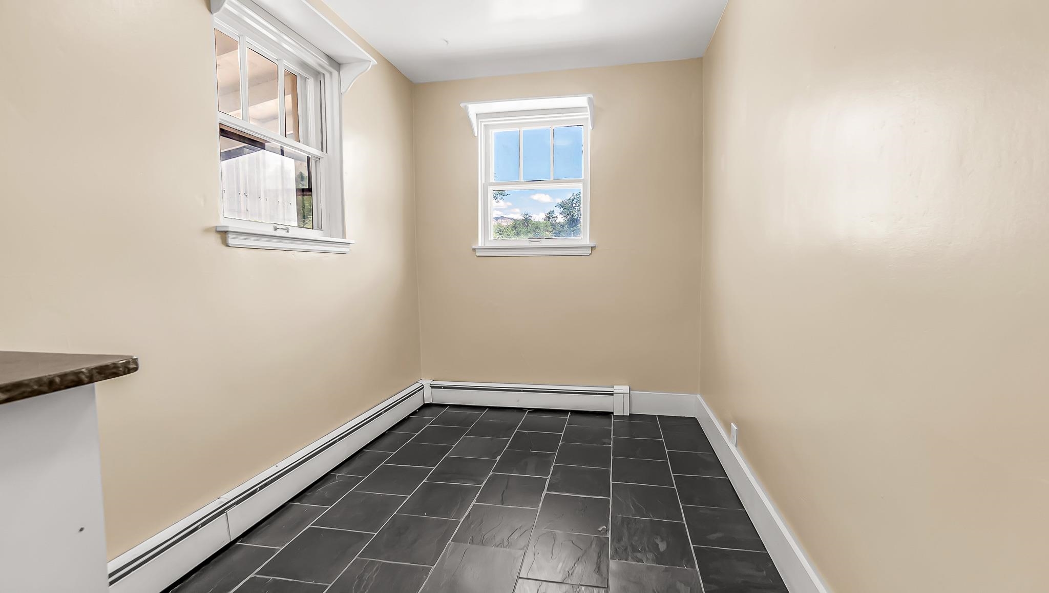 208 3rd Street Parachute, CO 81635 - Photo 9 of 40 a view of a hallway with wooden floor and a window