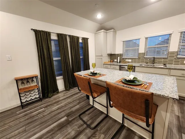 a living room with furniture and a mirror