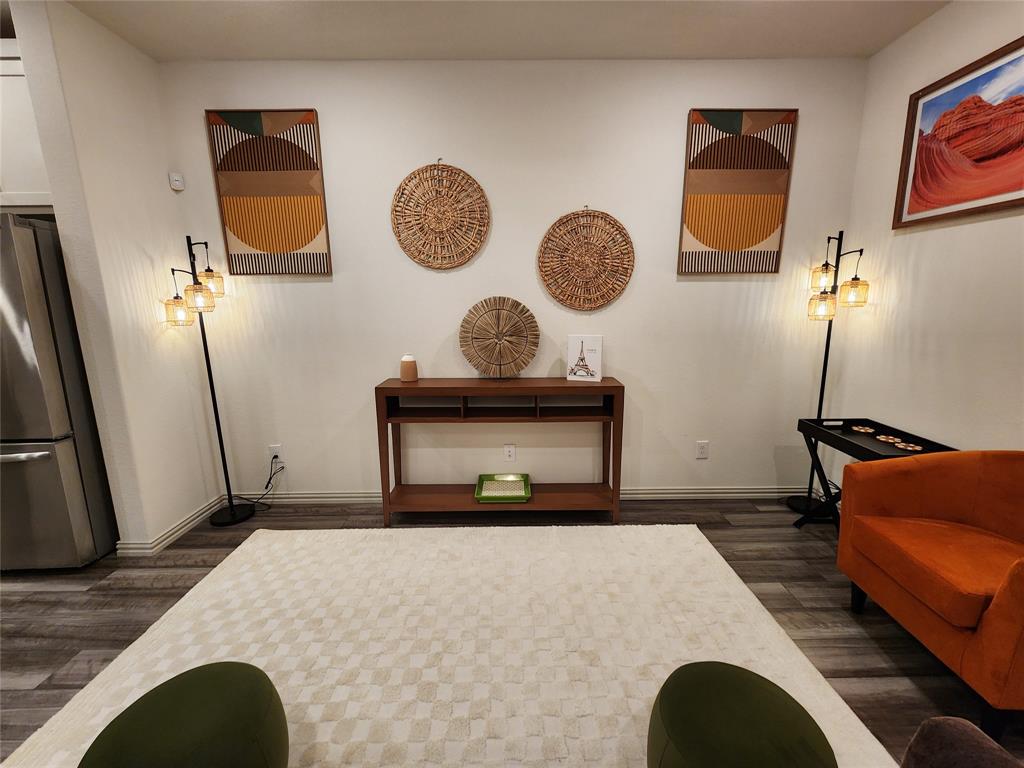 4708 Haltom Road Haltom City, TX 76117 - Photo 16 of 29 a living room with a couch and dresser