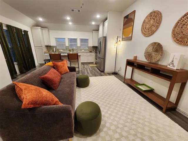 a kitchen with granite countertop lots of counter top space and stainless steel appliances