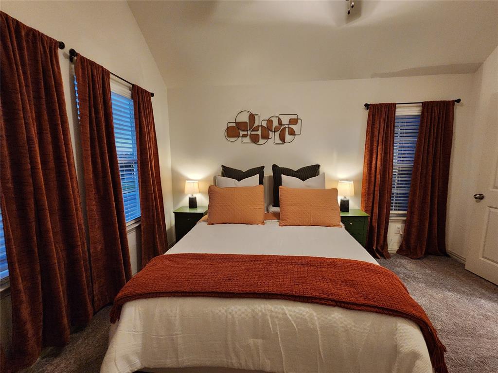 4708 Haltom Road Haltom City, TX 76117 - Photo 20 of 29 a bedroom with a bed and a mirror