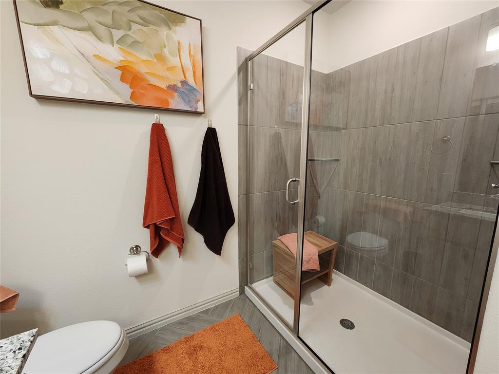 4708 Haltom Road Haltom City, TX 76117 - Photo 27 of 29 a bathroom with a sink toilet and shower