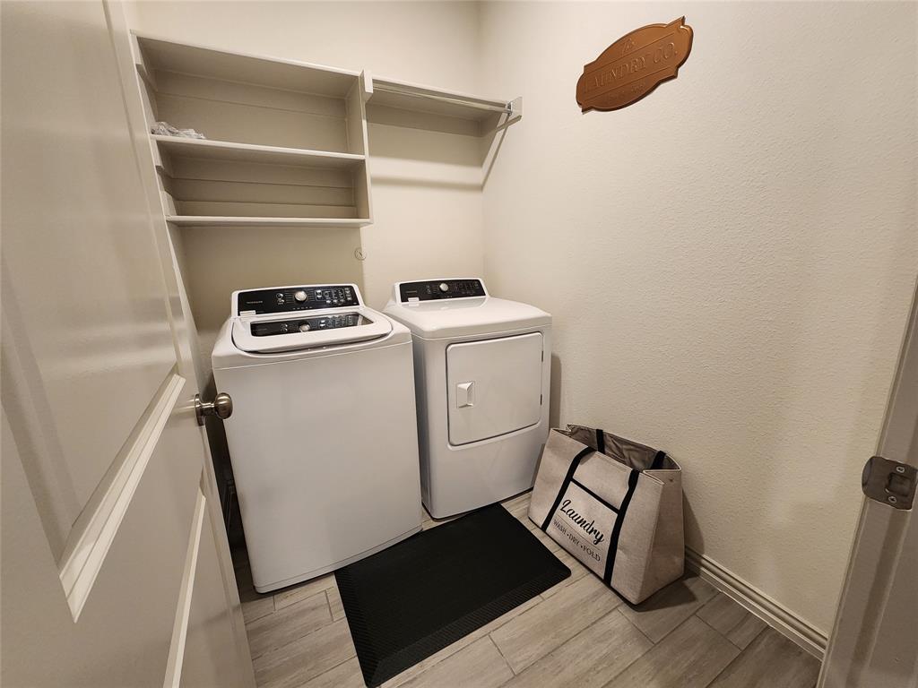 4708 Haltom Road Haltom City, TX 76117 - Photo 28 of 29 a utility room with dryer and washer