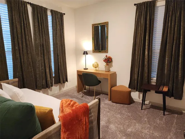 a living room with furniture a mirror and a piano