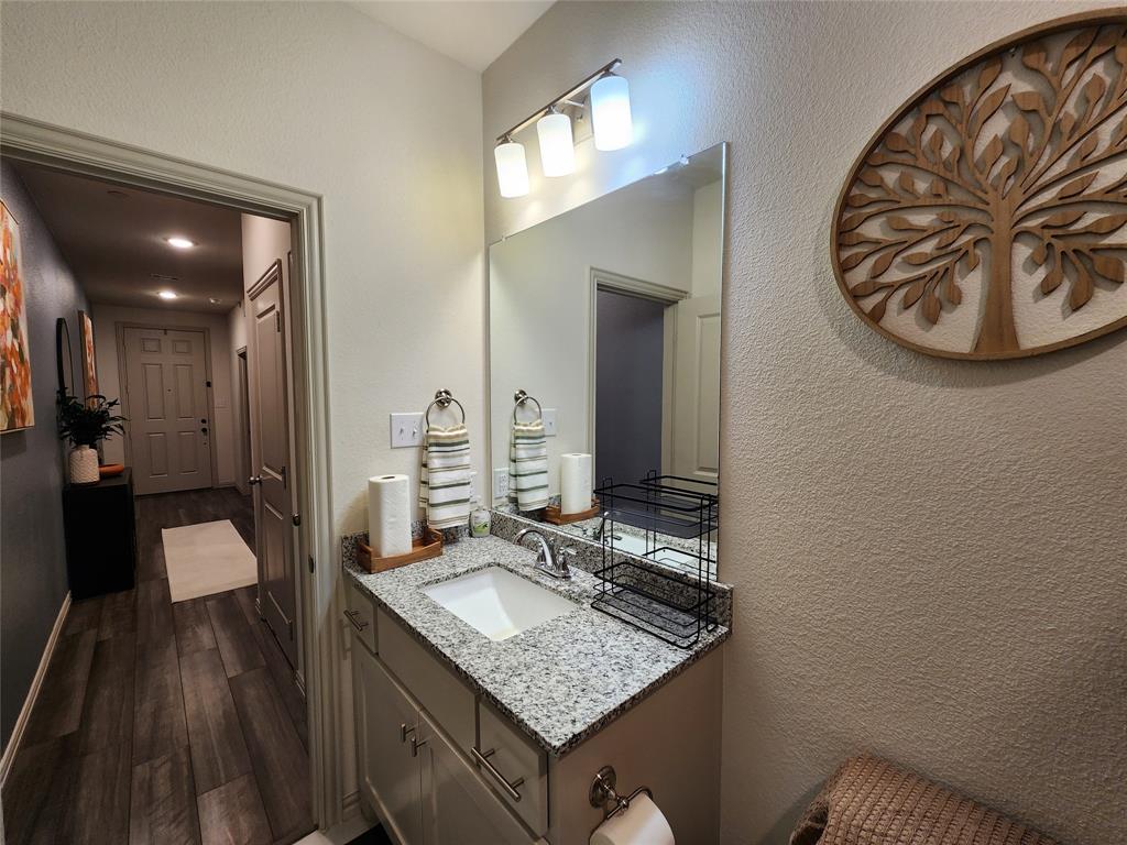 4708 Haltom Road Haltom City, TX 76117 - Photo 8 of 29 a bathroom with a sink and a mirror