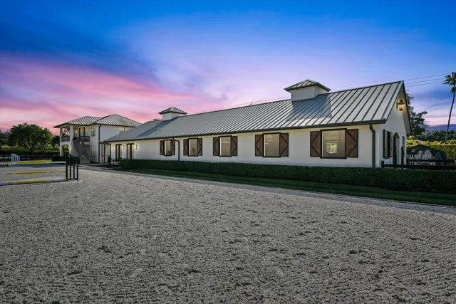 a kitchen with granite countertop stainless steel appliances a refrigerator stove and sink