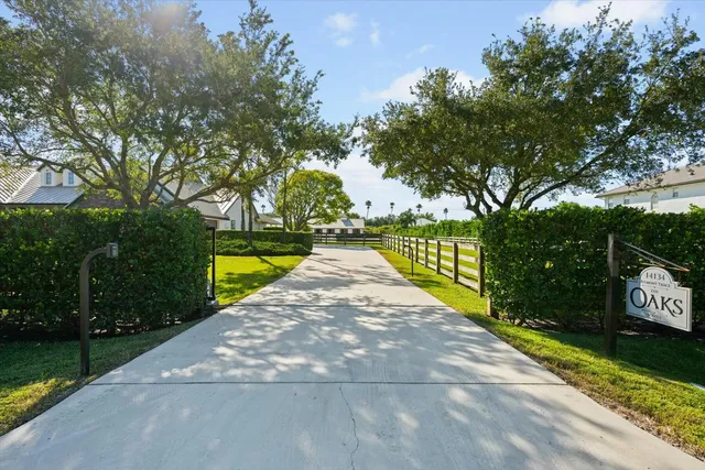 a bathroom with a double vanity sink toilet mirror and shower