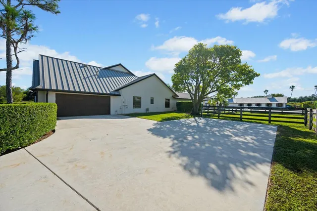 a living room with fireplace furniture and a wooden floor
