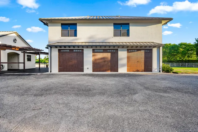 a view of house with outdoor space swimming pool and outdoor seating